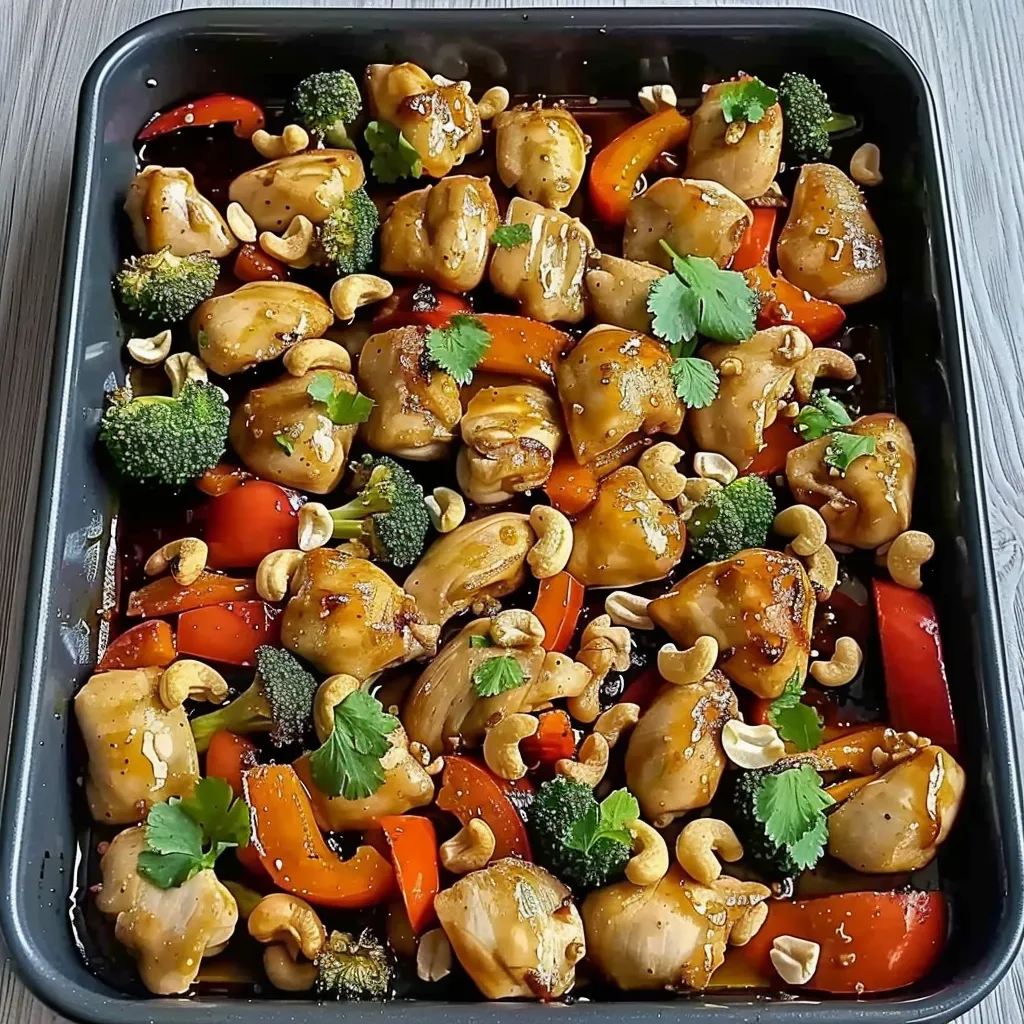 A pan of food with broccoli, carrots, and peppers.