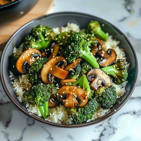 A bowl of rice with mushrooms and broccoli.