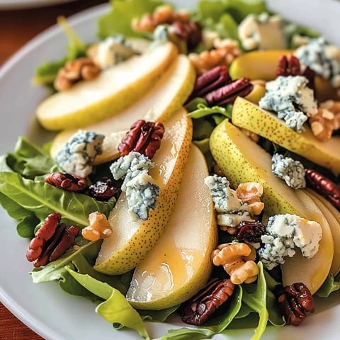 A plate of food with a salad and a slice of apple.